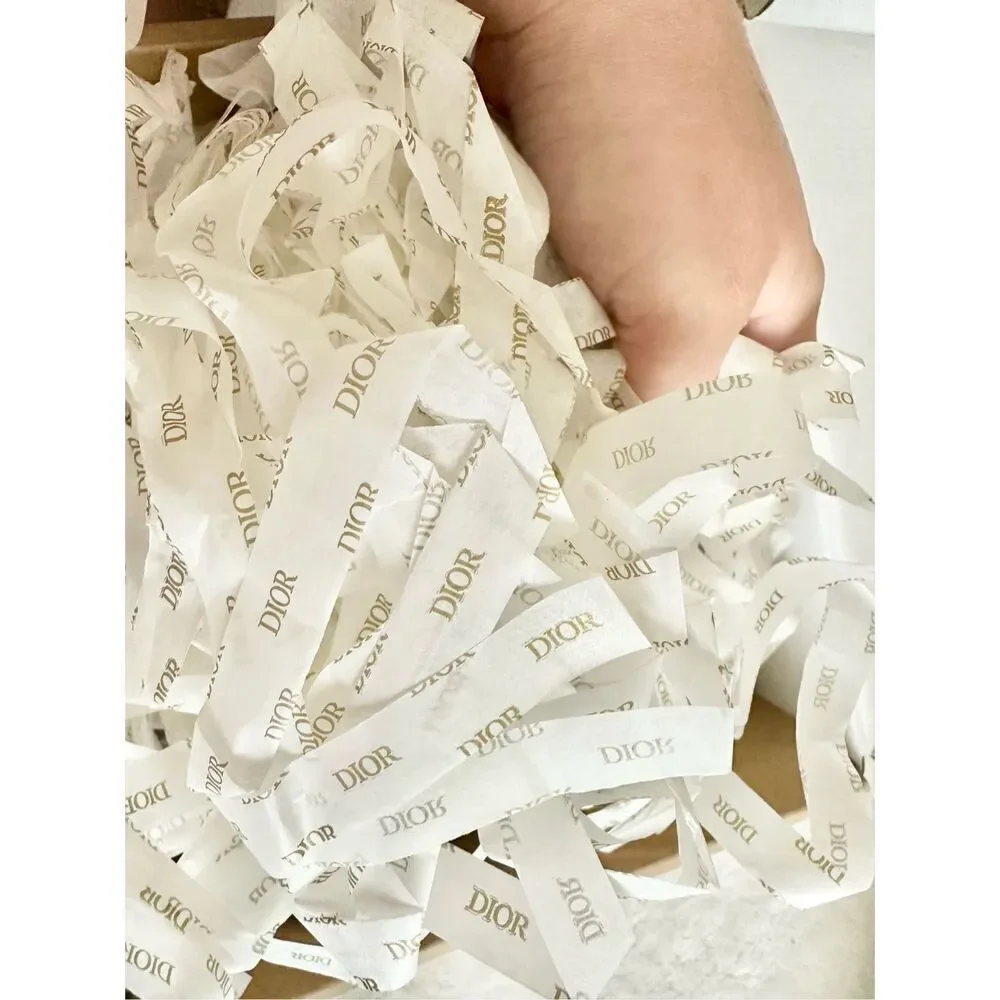 Handful of Dior shredded tissue paper ￼